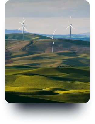 Wind turbines in a green field.